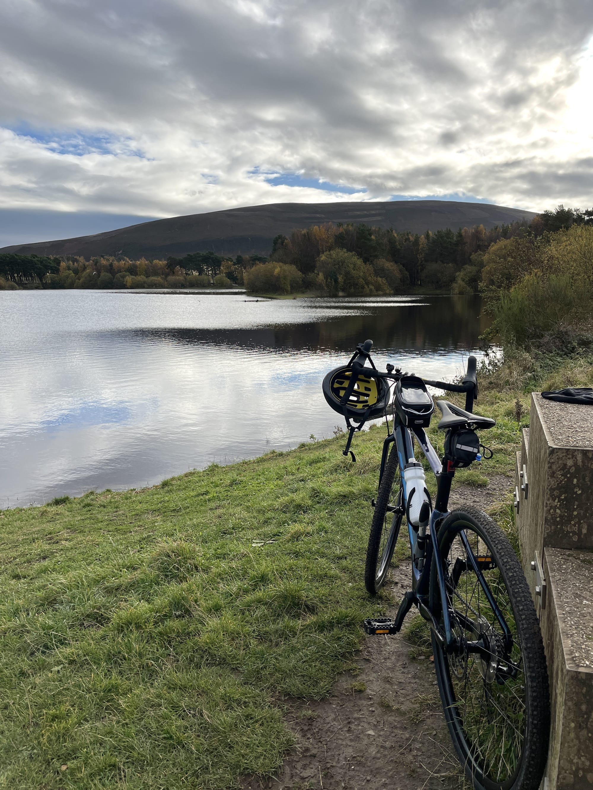 A gravel bike beside a reservoir