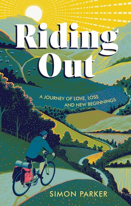 Book cover of 'Riding Out' by Simon Parker with the sub-title reading 'A journey of love, loss and new beginnings.' The cover consists of a cyclist going downhill towards the green and hilly countryside with the sun shining over the horizon.